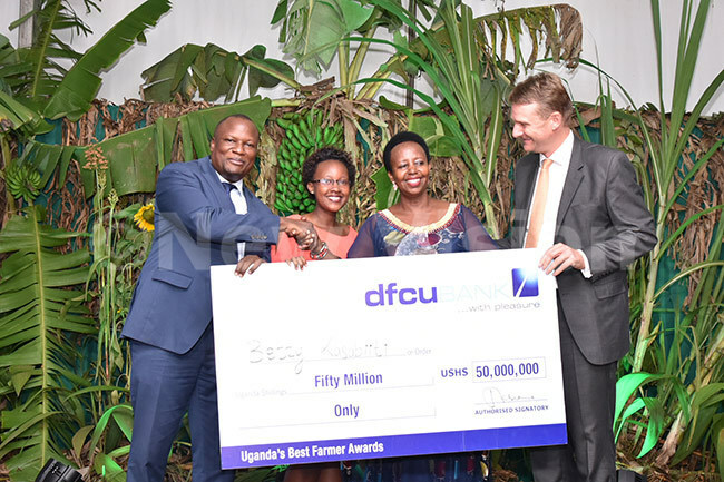 a group of people holding a large check